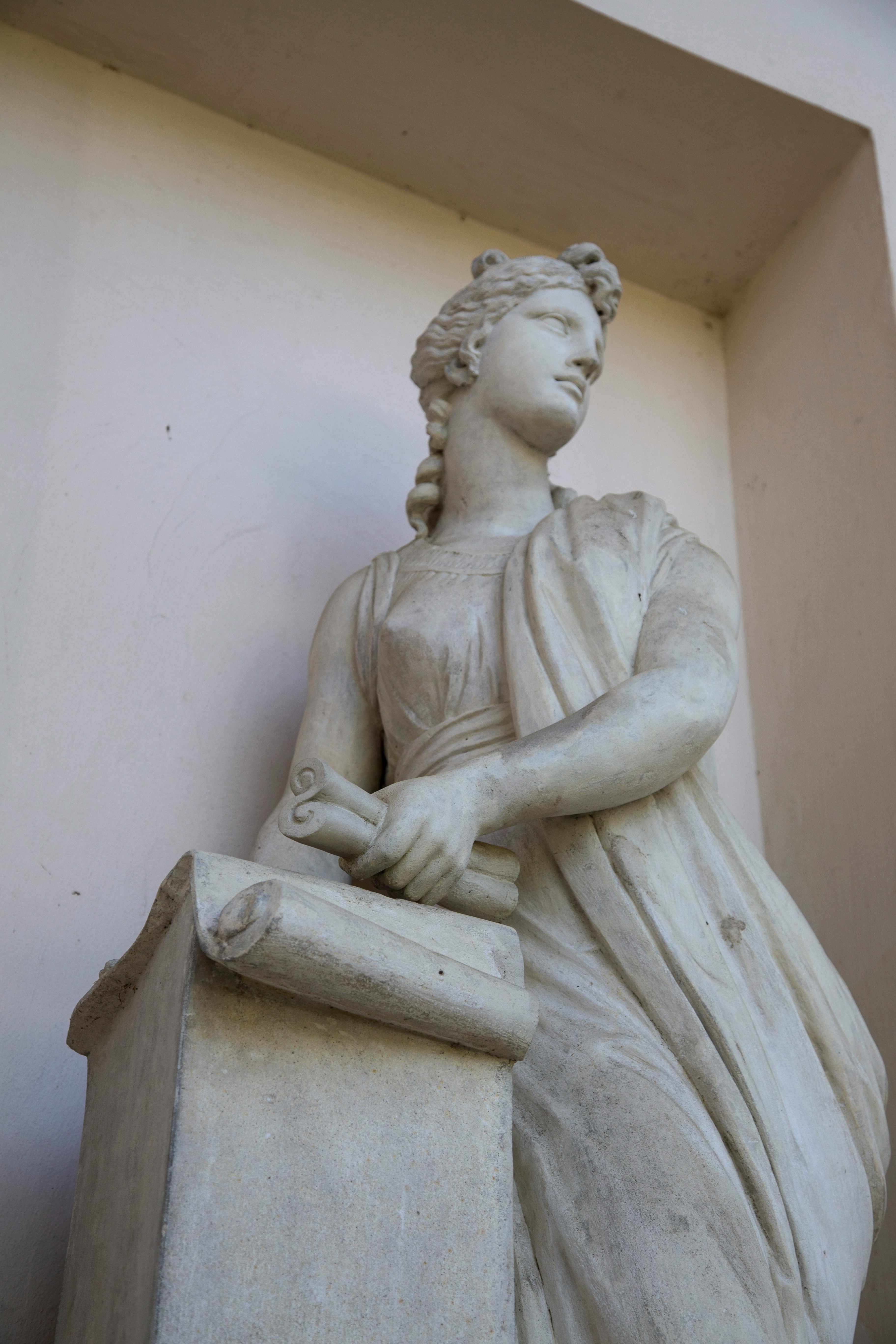 white concrete statue of a man